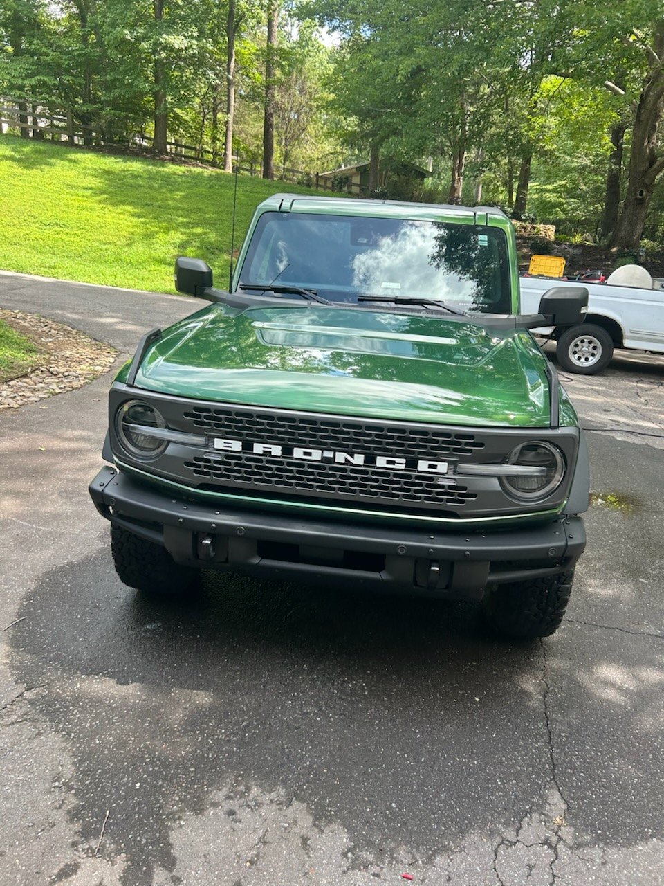 Green Ford Bronco after a mobile exterior wash