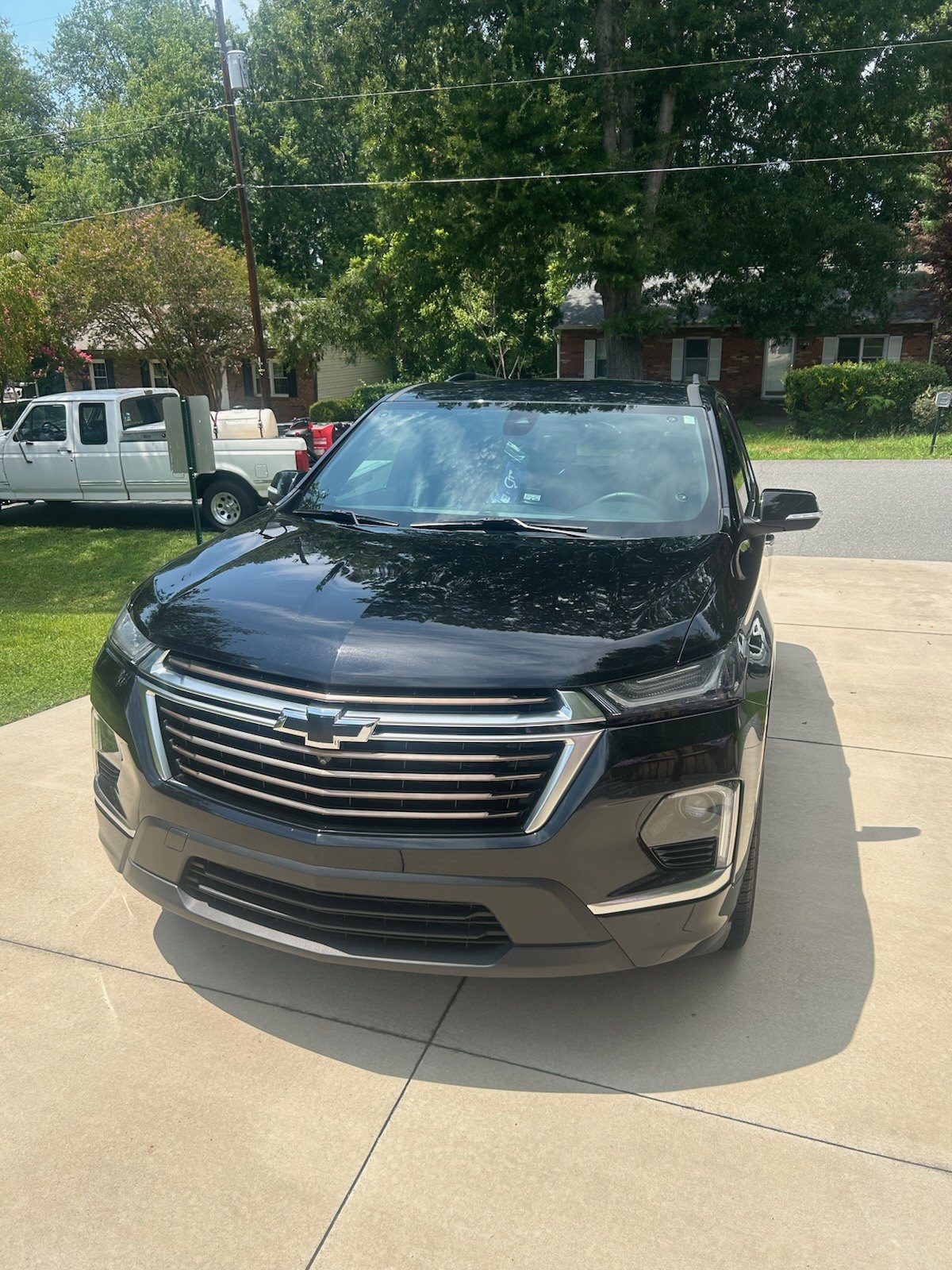 Black Chevrolet Equinox with a clean front fascia after mobile detailing