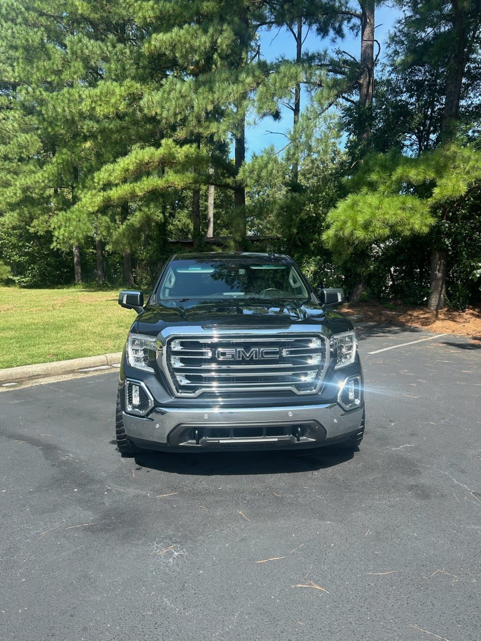 Black GMC Sierra after interior and exterior detailing with wax